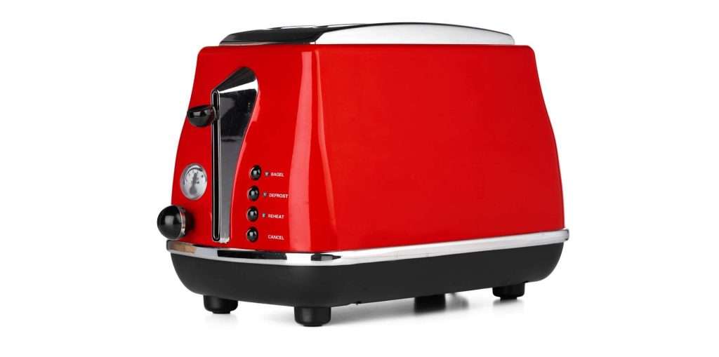 A red toaster with black and silver accents, featuring a lever, dial, and buttons for slice, defrost, reheat, and cancel functions.