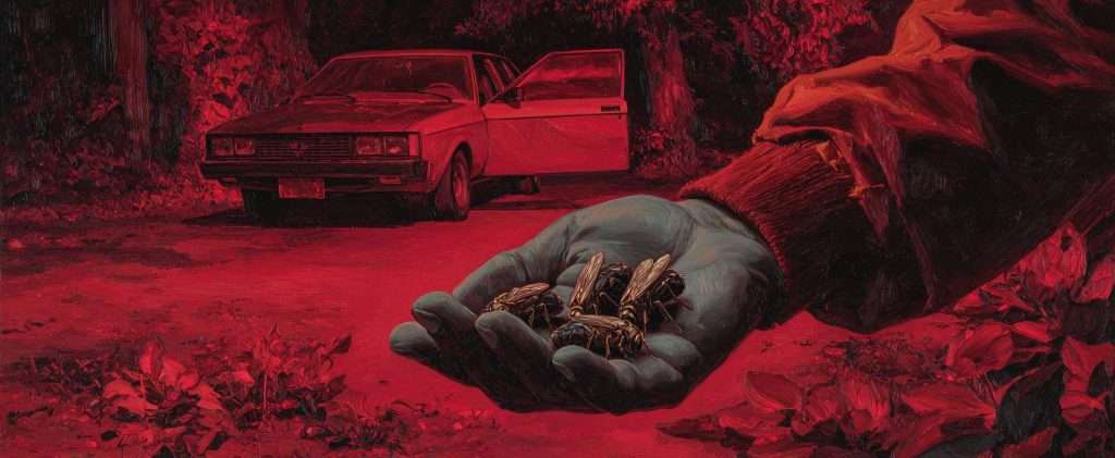 A hand holds several insects in the foreground, with a car parked on a forest road and its door open in the background. The entire scene has a red tint.