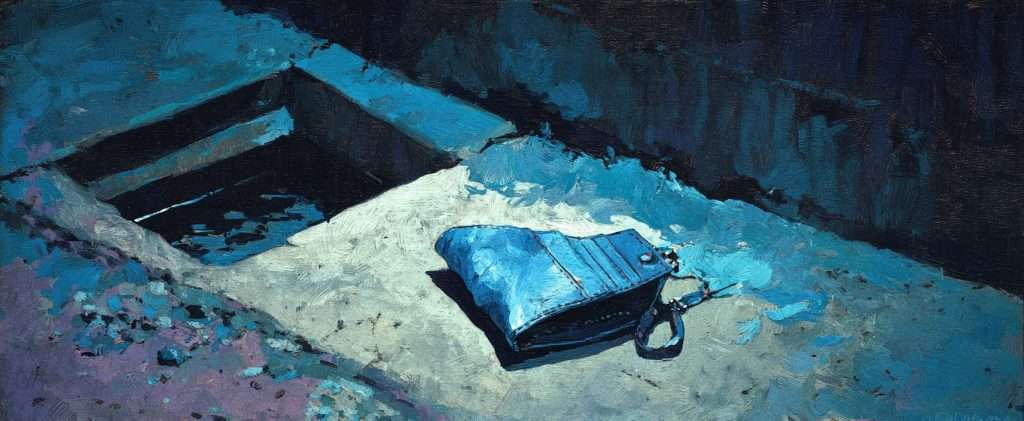 A blue purse lies on a sunlit concrete surface near an open storm drain, casting shadows in the bright light.