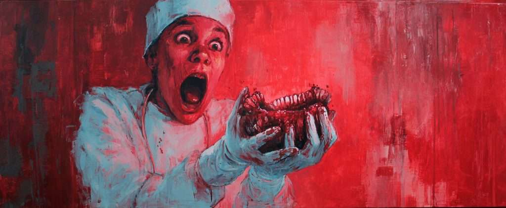 A person in medical attire holds a set of bloody dentures with a shocked expression against a red-painted background.